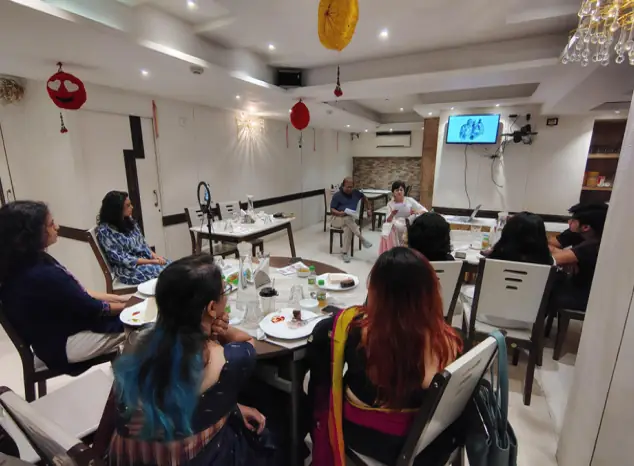 A reading session around dining tables